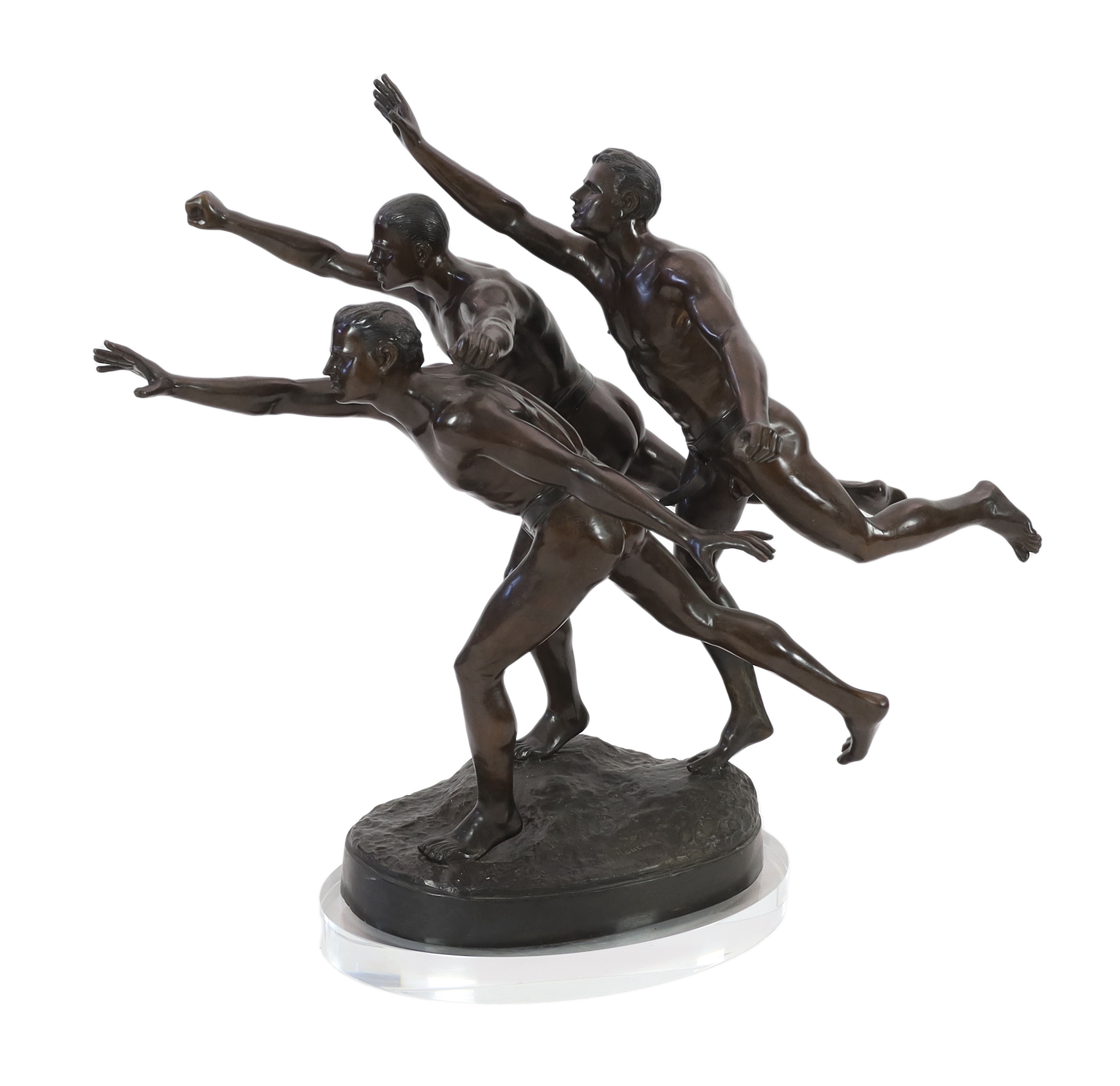 After Alfred Boucher (French, 1850-1934). A large bronze group of three runners at the finishing line, 'Au But', 128cm long, 78cm deep, 111cm high